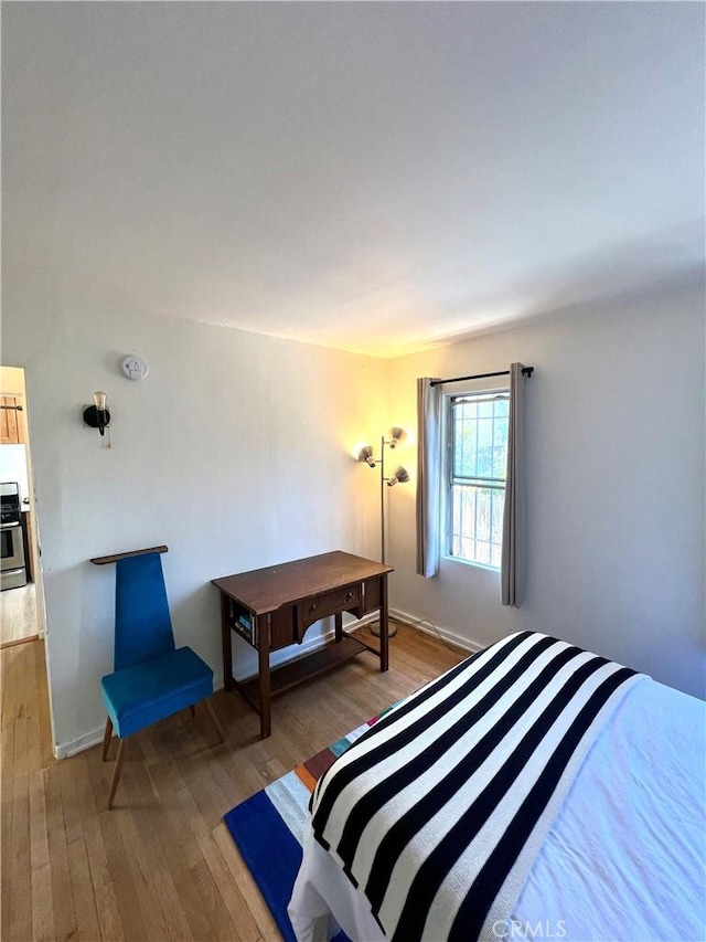 bedroom with wood-type flooring