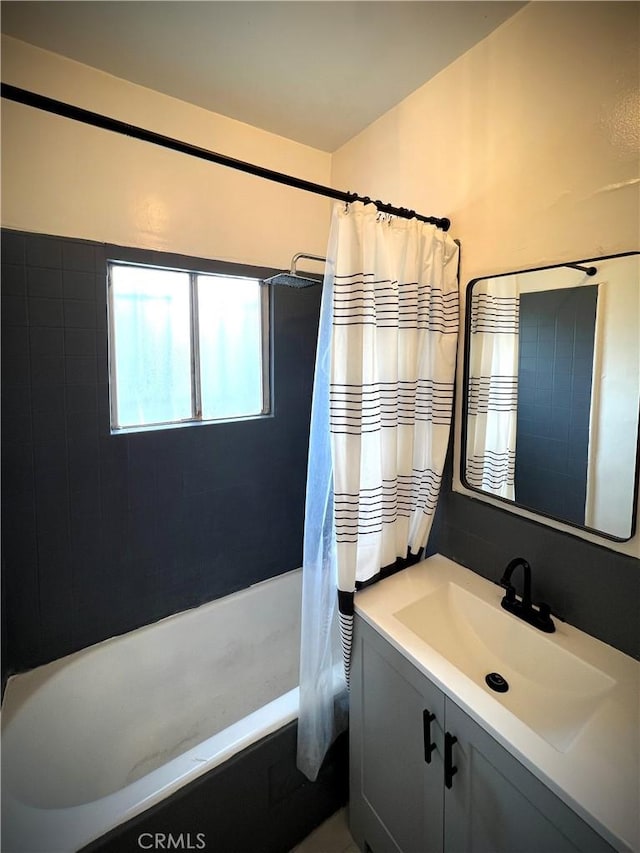full bath featuring shower / bath combination with curtain and vanity