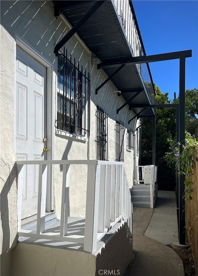 view of property exterior featuring a lanai and stucco siding