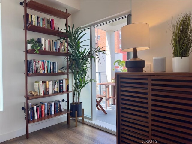 1245 N New Hampshire Ave Unit 4, Los Angeles, CA 90029 - sitting room with baseboards, wood finished floors, and a healthy amount of sunlight