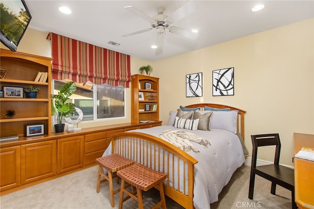 bedroom with visible vents, recessed lighting, and light colored carpet