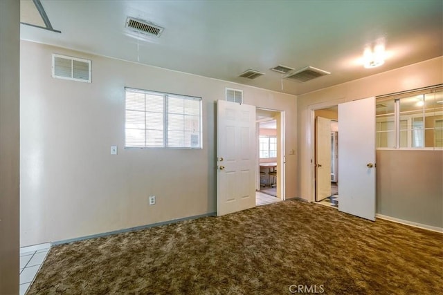 201 E Olive St, San Bernardino, CA 92410 - unfurnished room with visible vents and carpet flooring
