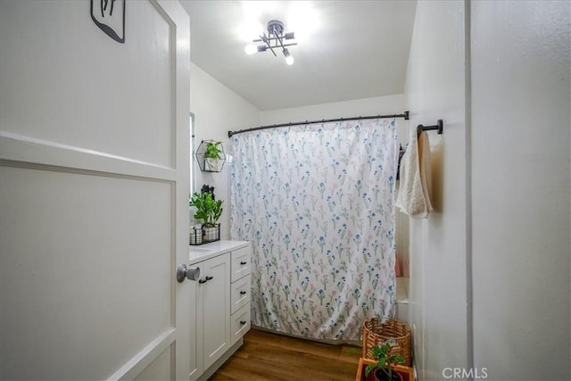 201 E Olive St, San Bernardino, CA 92410 - bathroom with vanity, shower / tub combo with curtain, and wood finished floors