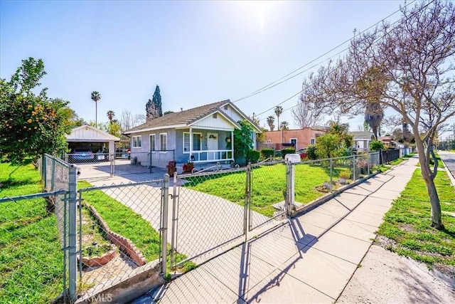 201 E Olive St, San Bernardino, CA 92410 - view of front of property featuring a gate, stucco siding, a front yard, and a fenced front yard