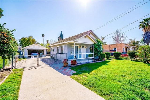 201 E Olive St, San Bernardino, CA 92410 - bungalow-style house featuring a gate, fence, covered porch, a garage, and a front yard