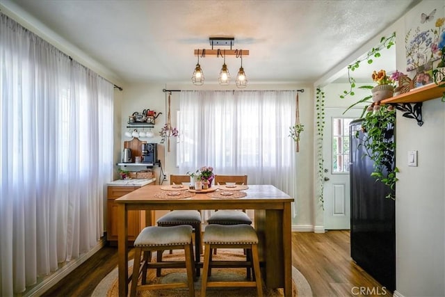 201 E Olive St, San Bernardino, CA 92410 - dining area featuring wood finished floors