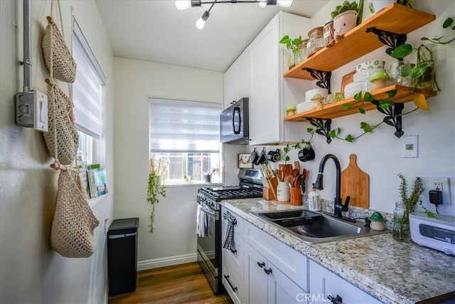 201 E Olive St, San Bernardino, CA 92410 - kitchen featuring a sink, stainless steel gas range, white cabinetry, open shelves, and black microwave