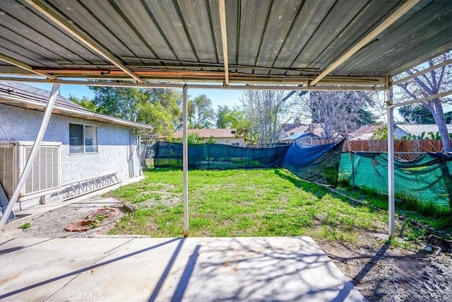 201 E Olive St, San Bernardino, CA 92410 - view of yard featuring a fenced backyard, central AC, and a patio