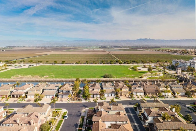4111 Adriatic St, Oxnard, CA 93035 - aerial view of property and surrounding area featuring nearby suburban area, rural landscape, and a water and mountain view