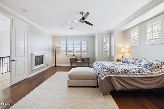 4111 Adriatic St, Oxnard, CA 93035 - bedroom featuring wood finished floors, ornamental molding, a glass covered fireplace, and a ceiling fan