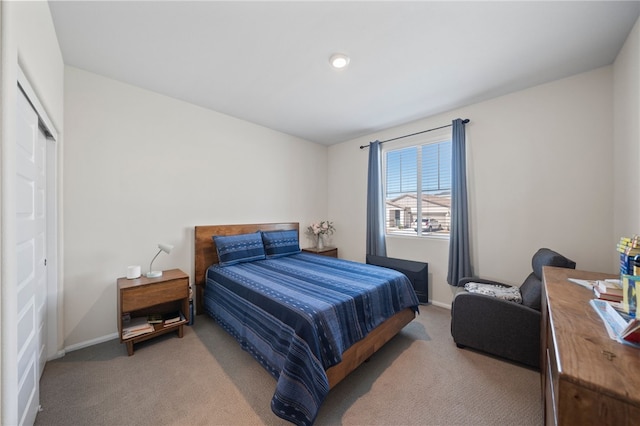 carpeted bedroom with baseboards