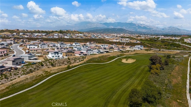 birds eye view of property with a residential view, a mountain view, and golf course view