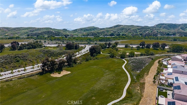 birds eye view of property with a mountain view
