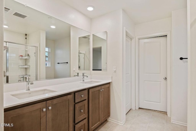 1926S Pump House Ln, Santa Paula, CA 93060 - bathroom featuring double vanity, a sink, recessed lighting, and a shower stall