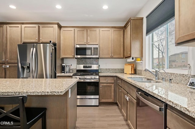1926S Pump House Ln, Santa Paula, CA 93060 - kitchen with light wood-style flooring, a breakfast bar, recessed lighting, appliances with stainless steel finishes, and a sink