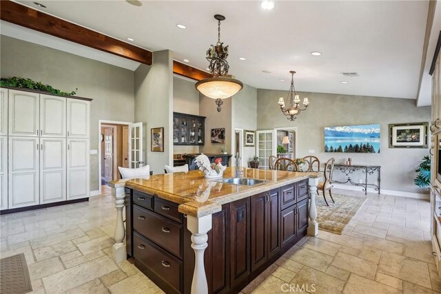 1547 Via Coronel, Palos Verdes Estates, CA 90274 - kitchen with a sink, stone tile flooring, high vaulted ceiling, recessed lighting, and pendant lighting