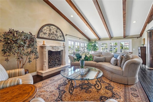 living area with baseboards, recessed lighting, a premium fireplace, dark wood-style flooring, and beam ceiling