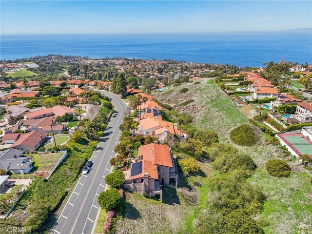 aerial view with a water view and a residential view