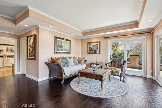 living area with baseboards, recessed lighting, wood finished floors, and ornamental molding