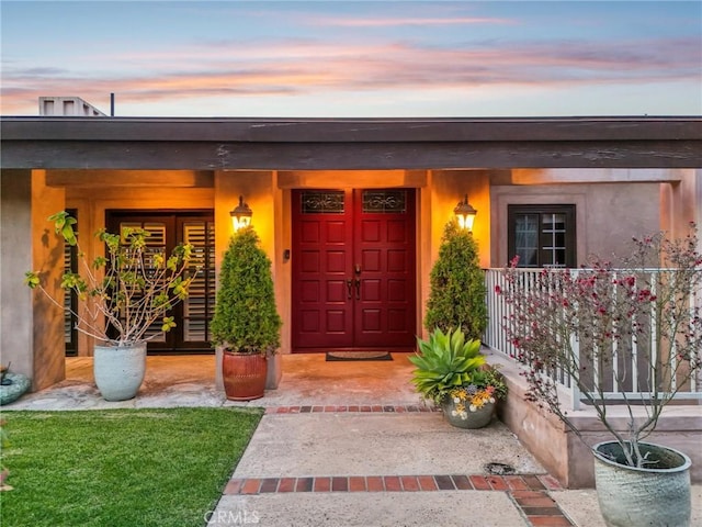 entrance to property with covered porch