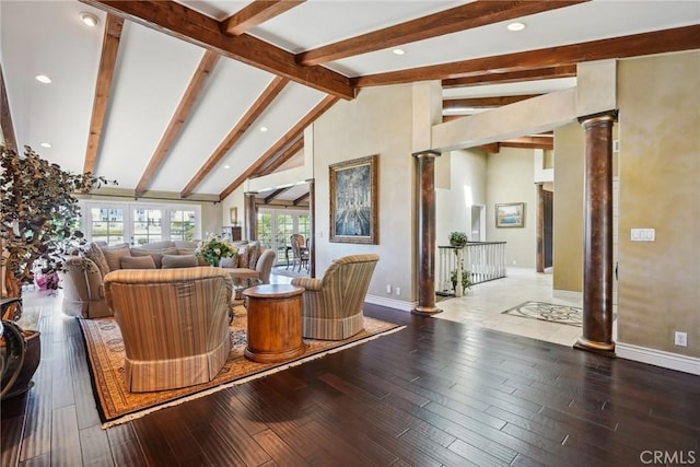 living room with beamed ceiling, decorative columns, hardwood / wood-style flooring, and baseboards
