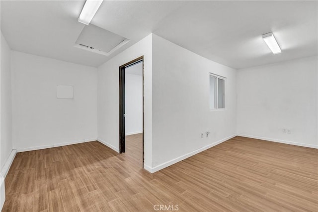 2001 Hacienda Rd, La Habra Heights, CA 90631 - unfurnished room with light wood-type flooring, attic access, and baseboards