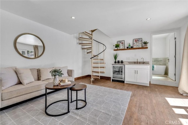 2001 Hacienda Rd, La Habra Heights, CA 90631 - living area with beverage cooler, bar with sink, light wood-style floors, stairway, and recessed lighting