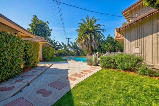 2001 Hacienda Rd, La Habra Heights, CA 90631 - view of green lawn featuring a patio area and an outdoor pool