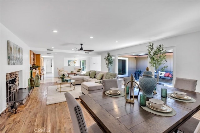2001 Hacienda Rd, La Habra Heights, CA 90631 - dining room with light wood-style floors, recessed lighting, ceiling fan, and a high end fireplace