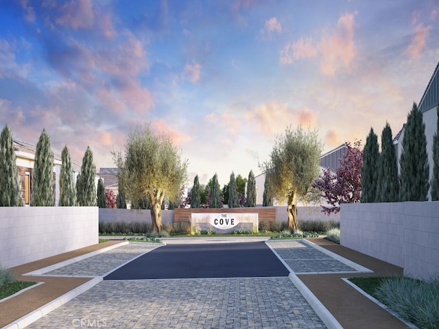 view of parking / parking lot with fence