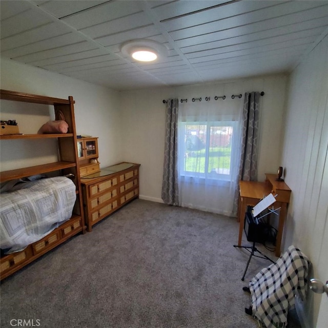 carpeted bedroom featuring baseboards