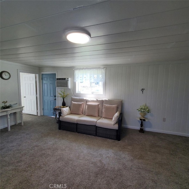 carpeted living area with baseboards and a wall mounted air conditioner