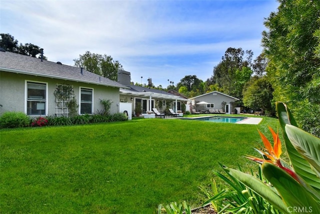 5223 Armida Dr, Woodland Hills, CA 91364 - view of grassy yard with an outdoor pool and a patio area