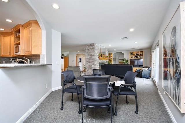 5223 Armida Dr, Woodland Hills, CA 91364 - dining space featuring carpet flooring, recessed lighting, and arched walkways