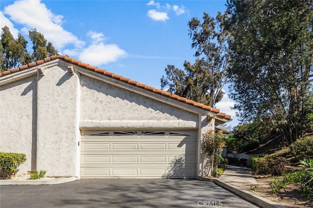 garage with driveway