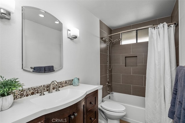 bathroom with vanity, shower / bathtub combination with curtain, and toilet