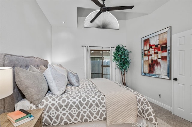 carpeted bedroom featuring baseboards and ceiling fan