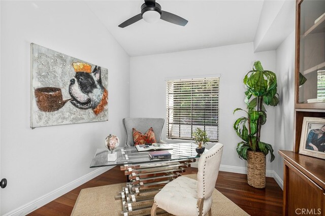 office area with vaulted ceiling, baseboards, dark wood-style floors, and ceiling fan