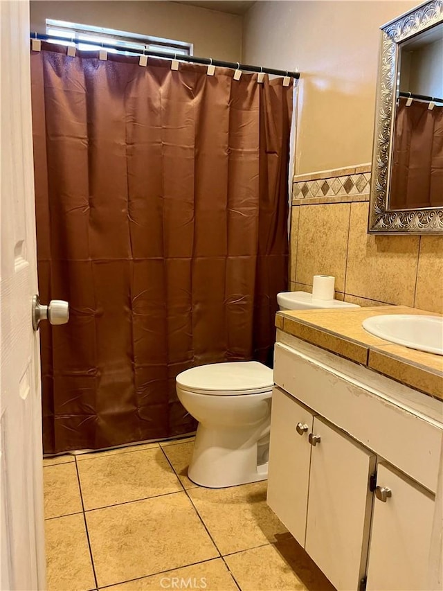 10715 3rd Ave, Hesperia, CA 92345 - full bathroom with vanity, tile patterned floors, tile walls, and a wainscoted wall