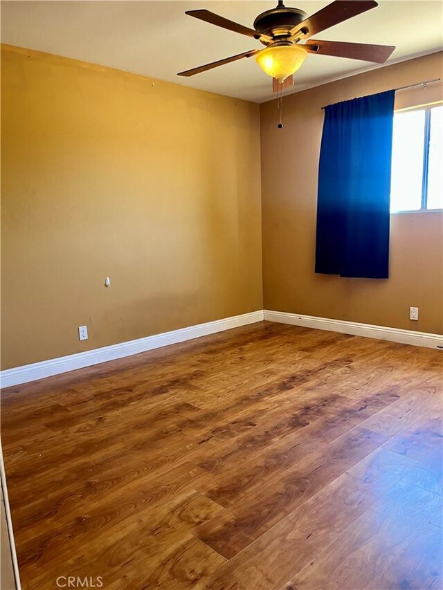 10715 3rd Ave, Hesperia, CA 92345 - empty room featuring wood finished floors and a ceiling fan
