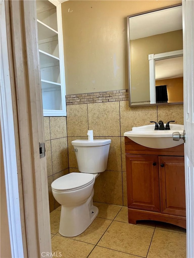 10715 3rd Ave, Hesperia, CA 92345 - half bath featuring vanity, tile patterned floors, and tile walls