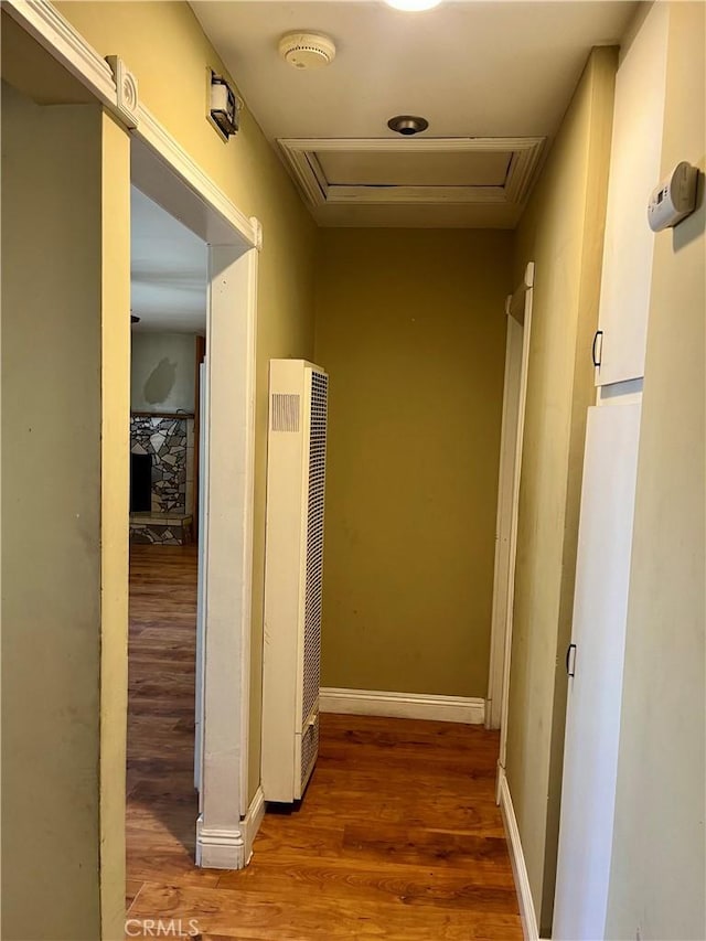 10715 3rd Ave, Hesperia, CA 92345 - corridor featuring a heating unit, attic access, and wood finished floors