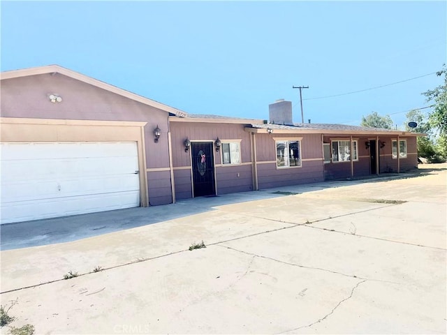 10715 3rd Ave, Hesperia, CA 92345 - ranch-style home featuring a chimney, concrete driveway, and a garage