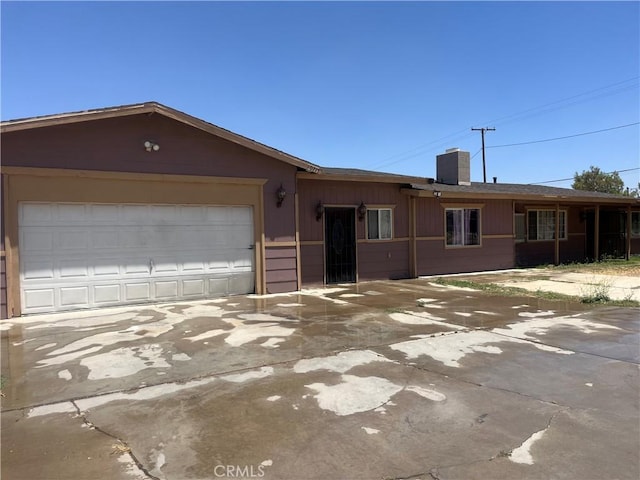 10715 3rd Ave, Hesperia, CA 92345 - ranch-style house with concrete driveway, a chimney, and a garage