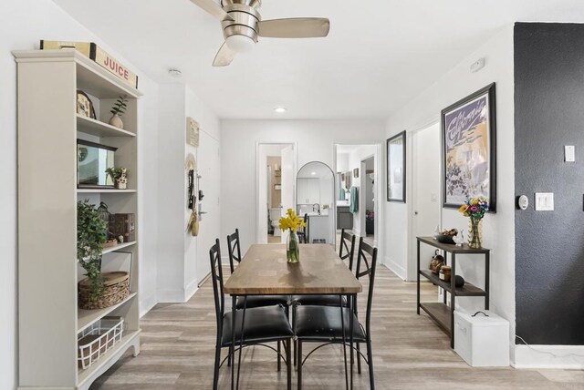 6780 Friars Rd Unit 243, San Diego, CA 92108 - dining area with light wood finished floors and a ceiling fan