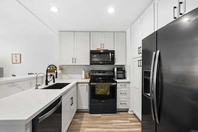 6780 Friars Rd Unit 243, San Diego, CA 92108 - kitchen with refrigerator with ice dispenser, range with electric stovetop, dishwasher, a peninsula, and light wood finished floors