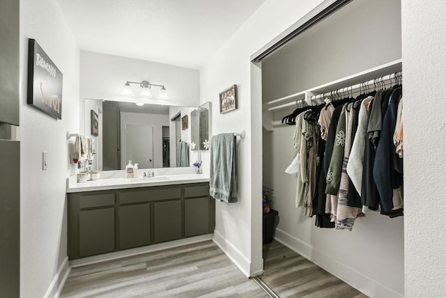 6780 Friars Rd Unit 243, San Diego, CA 92108 - full bath featuring wood finished floors, vanity, and a spacious closet