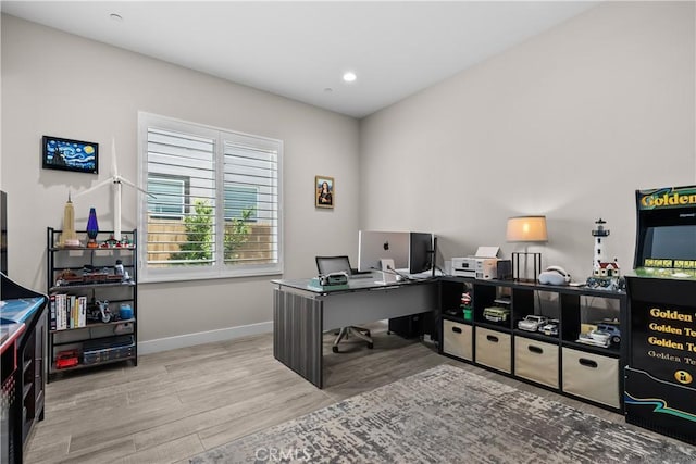 office area featuring baseboards, recessed lighting, and wood finished floors