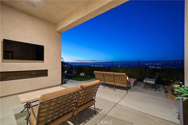 view of patio featuring an outdoor hangout area and a fenced backyard