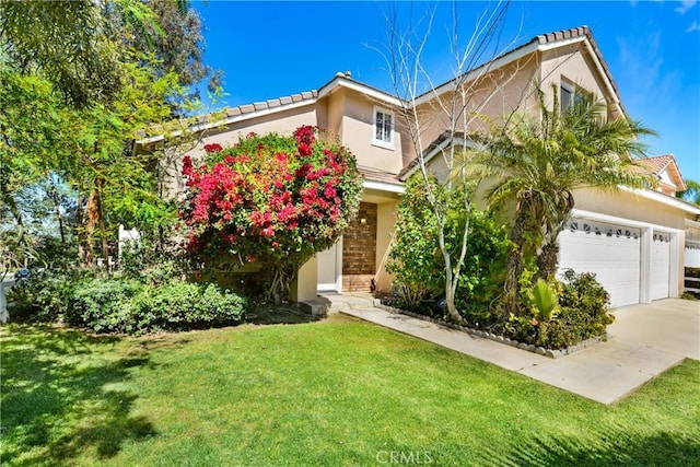 obstructed view of property featuring a front yard, stucco siding, and concrete driveway